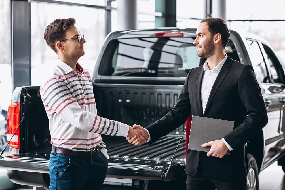 Handing over car keys to a customer